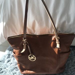 Soft leather Michael Kors tote-shows signs of wear